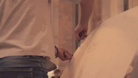 Close up of child hand drawing on large sheet of paper Stock Footage 78766496