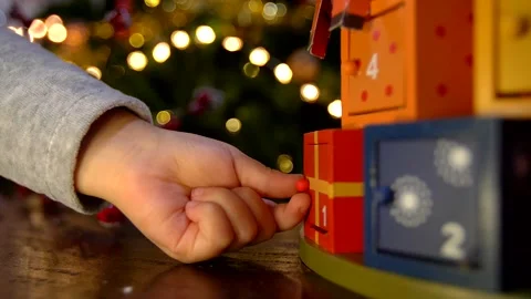 Close up of child hand opening advent calendar Stock Footage 139918327