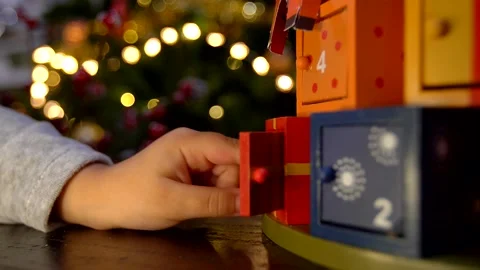Close up of child hand opening advent calendar Stock Footage 139920984