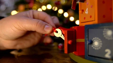 Close up of child hand opening advent calendar 動画素材 139923561