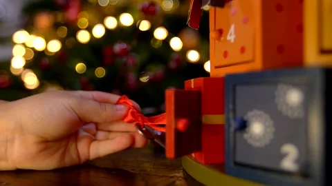 Close up of child hand opening advent calendar Stock Footage 139963489
