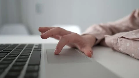 Close-up child hand using the touchpad on laptop to study at home Stock Footage 234985206