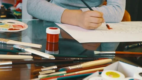 Close-up of child hands drawing picture with paintbrush Stock Footage 131002105