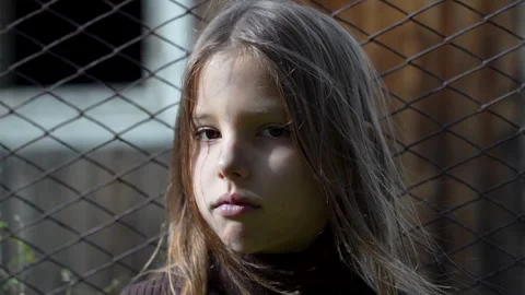 Close-up of child hands holding wire fence.  Little girl behind wire fence 스톡 동영상 286125480