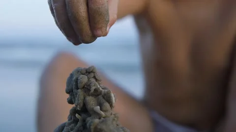 Close up of child hands making sand castle on sea background.Slow motion Video stock 50148406