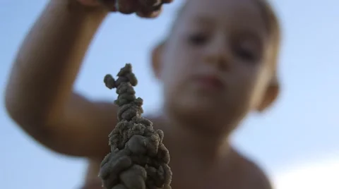 Close up of child hands making sand castle on the beach.Slow motion Stock Footage 50148449