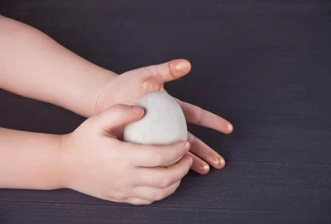 Close up of child holding Easter eggs Stock Photos