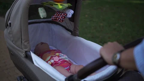 Close-up child lies in a stroller Video stock 227875725