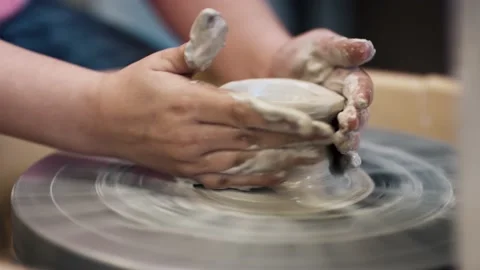 Close up of a child making pottery	 Stock Footage 132726897