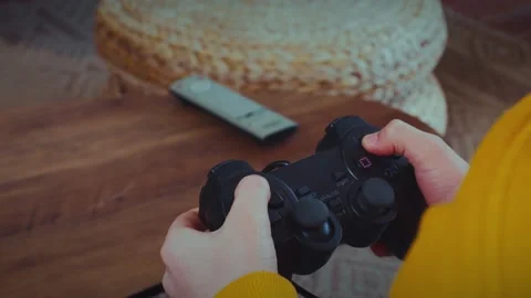 Close-up of child playing video games using gamepad enjoying game Stock Footage 229552340