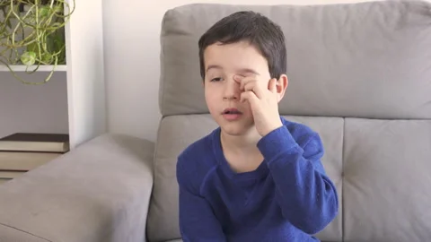 Close up of child scratching itchy eye Video stock 250605280