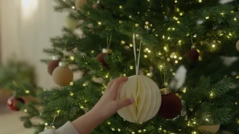 Close-up,  child touching Christmas tree decorations with his hand Stock Footage 321682917