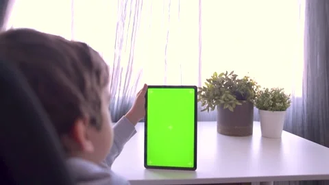 Close up Child using Digital Tablet with Green mock up Screen, Chroma Key Stock Footage 171828735