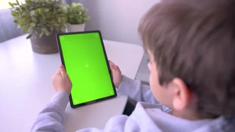 Close up Child using Digital Tablet with Green mock up Screen, Chroma Key Video stock 171828750