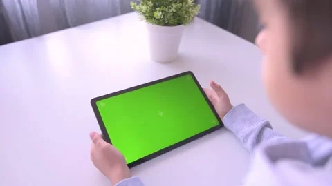 Close up Child using Digital Tablet with Green mock up Screen, Chroma Key Stock Footage 171828867