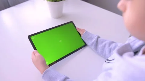 Close up Child using Digital Tablet with Green mock up Screen, Chroma Key Stock-Footage 171829138
