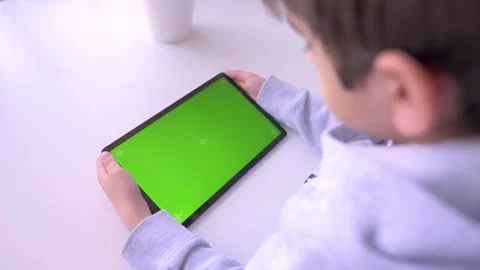 Close up Child using Digital Tablet with Green mock up Screen, Chroma Key Stock Footage 171829183