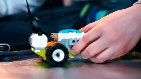 Close-up of childrehands assembling a constructor. Stock Footage 123725303
