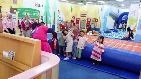 Close up of children dancing happily guided by the teacher and watched by t.. Stock Footage 275315349