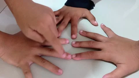 Close Up of Children Hands Playing Finger Counting Game Indoors 動画素材 321935926