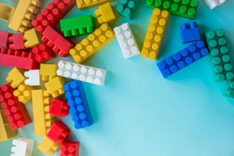 Close up Children plastic constructor. on a blue background stripe background Stock Photos