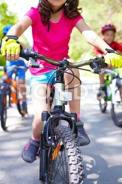 Close-up of childrens bike ridden by a girl Stock Photos