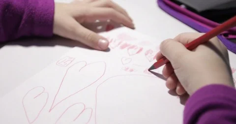 Close-up of children's hand painted red hearts on white paper. Stock Footage 84204799