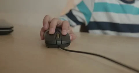 Close-up children's hand use computer mouse. 4K 10-bit Stock Footage 346557013