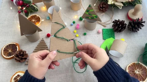 Close-up of children's hands decorating with twine. Zero waste concept. Stock Footage 256788730