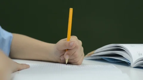 Close-up of children's hands I write with a pencil Stock Footage 92610342