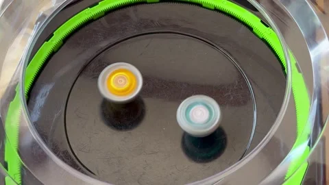 Close-Up of Children’s Hands Playing Beyblade Spinning Tops Battle Stock-Footage 314687450
