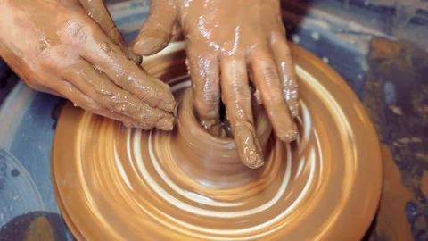 Close-up of children's hands sculpting ceramic dishes from clay in the workshop. Stock Footage 276776755