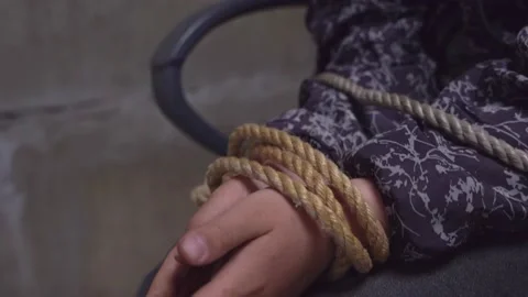 Close-up of children's hands tied with rope. child abduction.kidnapped Stock Footage 199656970