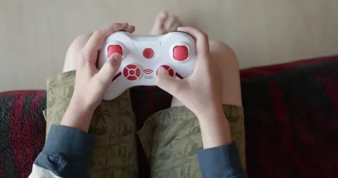 Close-up children's hands use joystick game controller playing video games. 4K Stock Footage 346603549