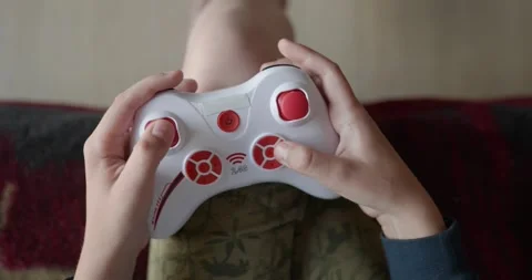 Close-up children's hands use joystick game controller playing video games. 4K Stock Footage 346603551