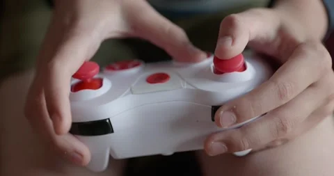 Close-up children's hands use joystick game controller playing video games. 4K Stock Footage 346603555