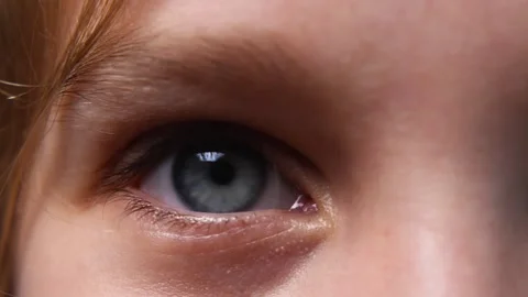A close-up of the child's blue eye. The eyeball is being examined Stock Footage 196929091