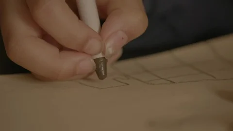 Close up of child's hand drawing with a crayon Stock Footage 103862993