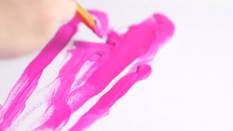Close-up of child's hand holding paint brush and drawing oil painting. Pain.. Stock Footage 260702829