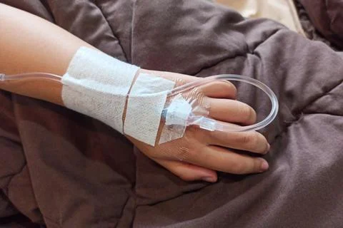Close up of a child's hand on an IV drip Stock Photos
