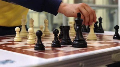 Close up of a child's hand playing chess Stock Footage 196383653