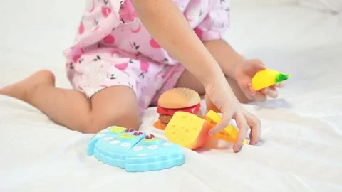 Close-up of child's hand playing with plastic toys Stock Footage 171405598