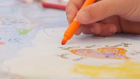 Close up of a child's hand as they draw with a felt tip pen Stock Footage 112003481