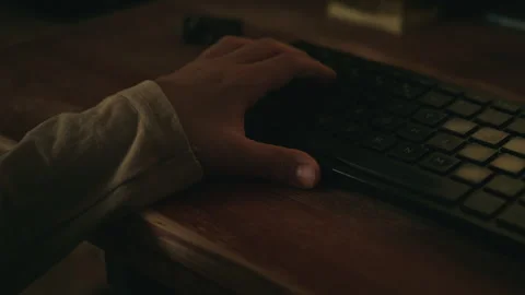 Close-up of a child's hand using a computer keyboard in low light. Technolo.. Stock-Footage 343626436