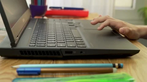 Close-up of a Child's Hand Using the Touchpad on a Laptop. The Child's Hand Touc Stock Footage 140521533