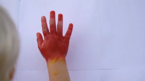 Close up of child's hands making prints on the wall with mother in slow motion Stock Footage 50268724