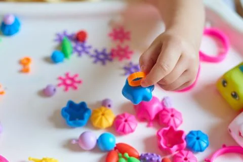 Close up of child's hands playing Stock Photos