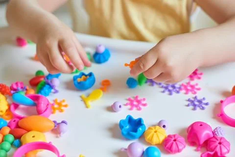 Close up of child's hands playing Stock Photos