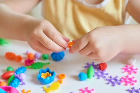 Close up of child's hands playing Stock Photos