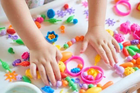 Close up of child's hands playing Stock Photos